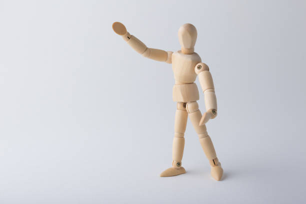istock Wooden dummy standing with open arms 1085334180