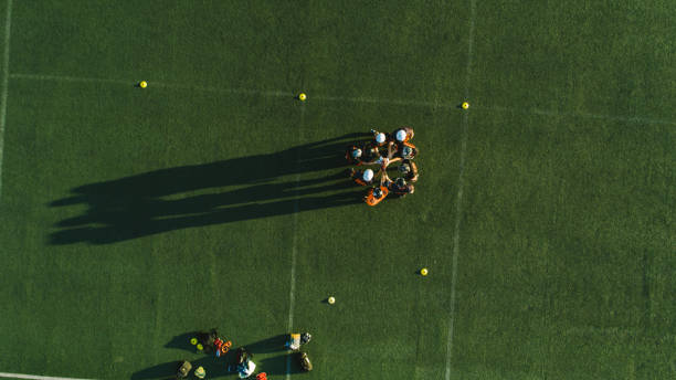 Drone point view of Rugby Team Playing Match At Stadium