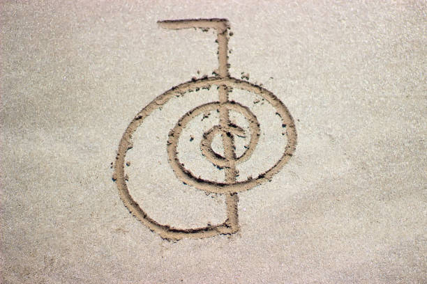 Reiki healing symbol cho ku rei on sand. Reiki healing symbol cho ku rei on sand. Alternative medicine concept. reiki photos stock pictures, royalty-free photos & images