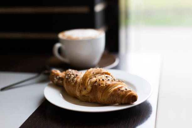 istock Food. Cappuccino and croissant 1085341786