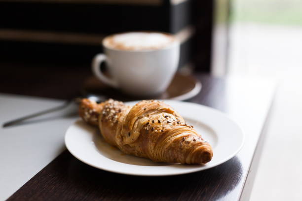 istock Food. Cappuccino and croissant 1085341850