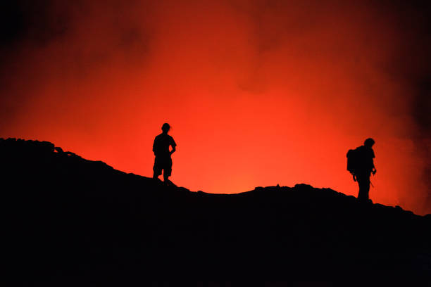 istock Tourists' silhouettes on Erta Ale Volcano edge 1085345304