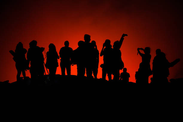 istock Tourists' silhouettes on Erta Ale Volcano edge 1085345316