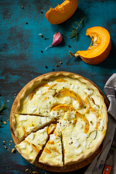 Classic Quiche Lorraine Pie with Pumpkin and Feta Cheese on blue concrete or stone table. Top view flat lay background. Copy space. Classic Quiche Lorraine Pie with Pumpkin and Feta Cheese on blue concrete or stone table. Top view flat lay background. Copy space. 15495 stock pictures, royalty-free photos & images