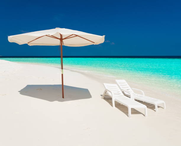 istock Maldives,  white sunbed and parasol! 1085355674