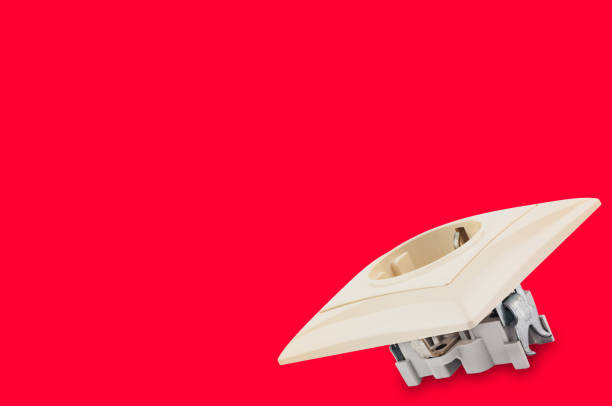 istock One plastic beige electrical outlet on red background with copy space for your text. Electricity concept 1085357888