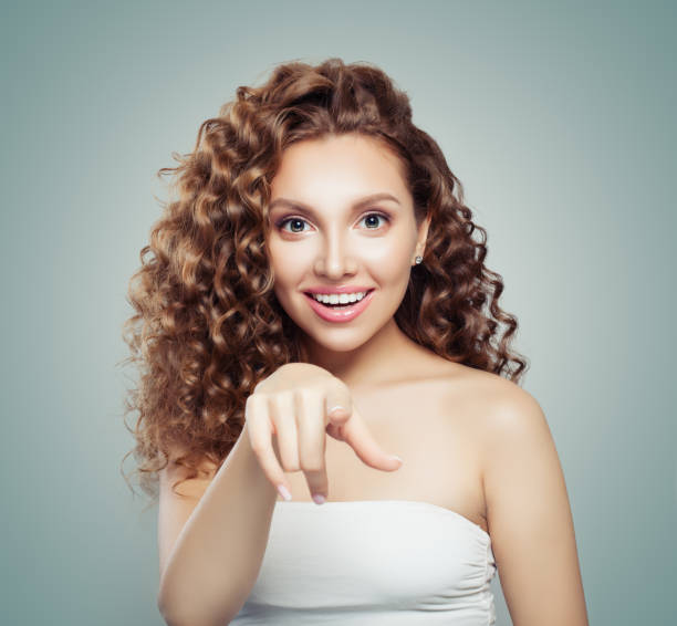 istock Young perfect woman pointing on blue background 1085362876