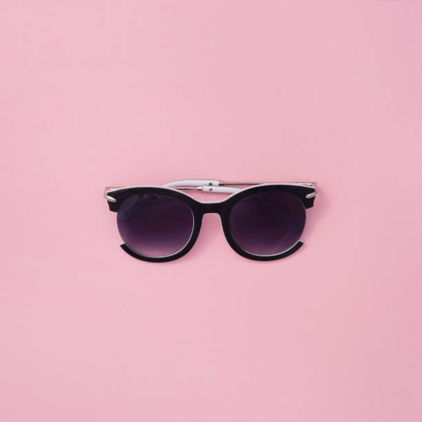 istock Sunglasses for women on a pink background. 1085366982