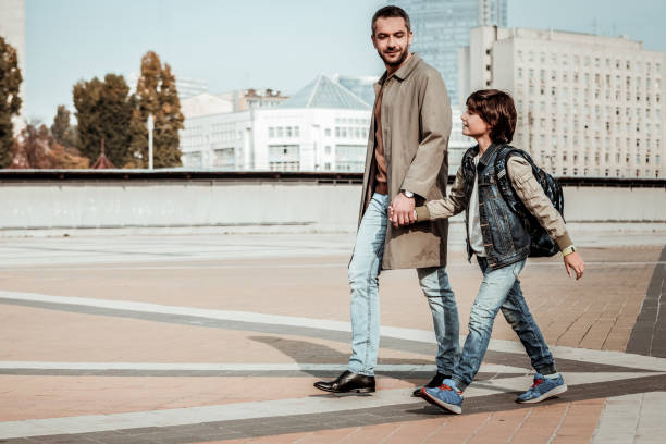 istock Father going hand in hand with his son 1085369042