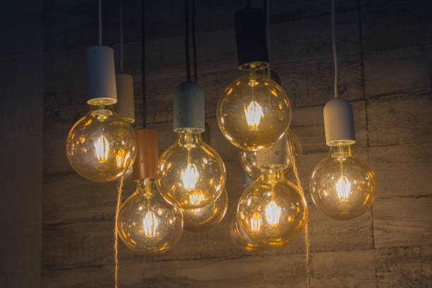 istock Vintage style light bulbs hanging from the ceiling 1085374812