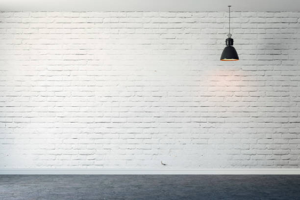 istock 3d room with white brick wall and ceiling lamp 1085375528