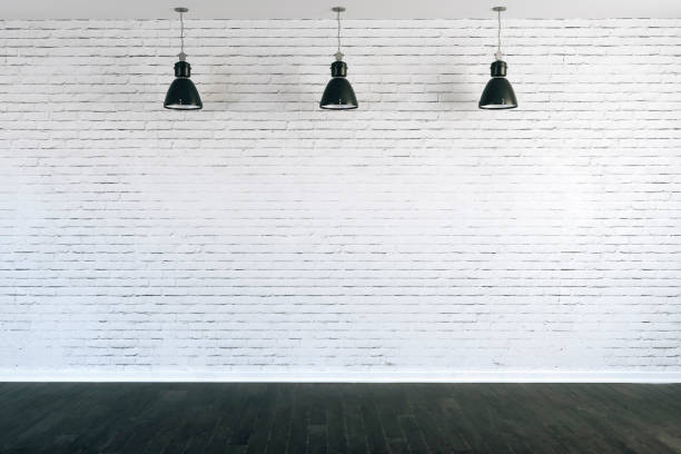 istock 3d room with white brick wall and ceiling lamp 1085376442