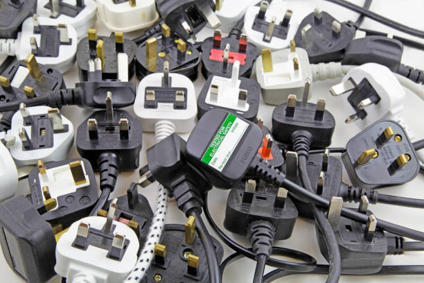 plan view of plugs Blurred background of three pin plugs with top of plug with test sticker amplifier plug stock pictures, royalty-free photos & images