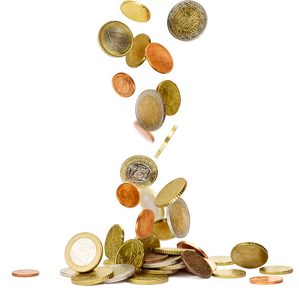 istock Euro coins being dropped against a white background 108537940