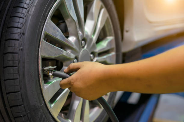 istock Filling air into a car tire 1085379956
