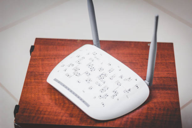 istock Modem of white broadband internet with two antennas raised with signal wireless 1085382420