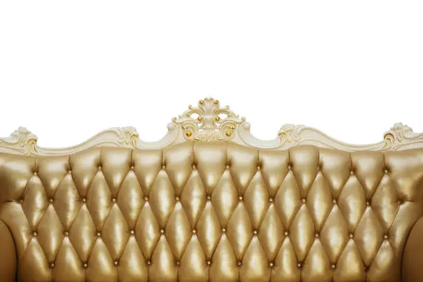 Photo of Back of a vintage sofa with gold upholstery on a white background. Isolated