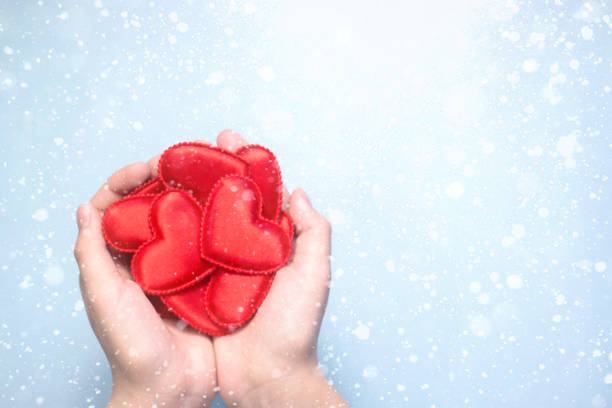 istock Valentine Day romantic composition flat lay with snowflakes, love holiday celebration with red heart blue background copy space 1085386820