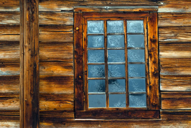 istock window in the log wall of an old building 1085390772