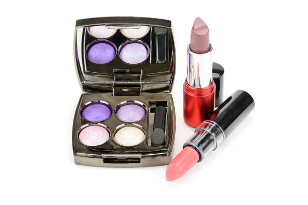 istock Lipsticks and eye shadow isolated on white background. 1085391494