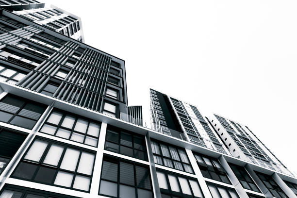 istock Modern high rise apartment buildings, white background, copy space 1085398396