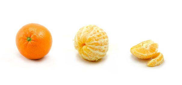 An orange at various stages of consumption isolated against a white background