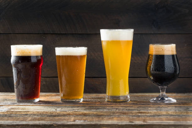 Refreshing Cold Craft Beer Assortment Refreshing Cold Craft Beer Assortment of IPA Lager and Stout india pale ale photos stock pictures, royalty-free photos & images