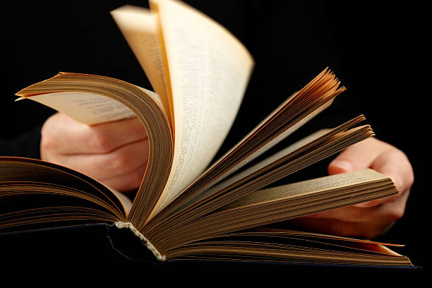 istock Hands flipping through the pages of a book  108543905