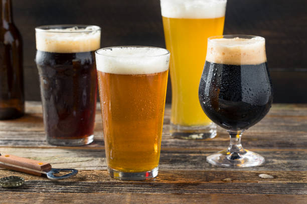 Refreshing Cold Craft Beer Assortment Refreshing Cold Craft Beer Assortment of IPA Lager and Stout craft beer photos stock pictures, royalty-free photos & images
