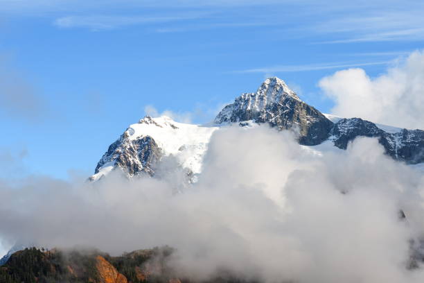 istock Clouds sweep over Mt Shuksan face in the Cascade Range during Autumn, Washington-USA 1085441702
