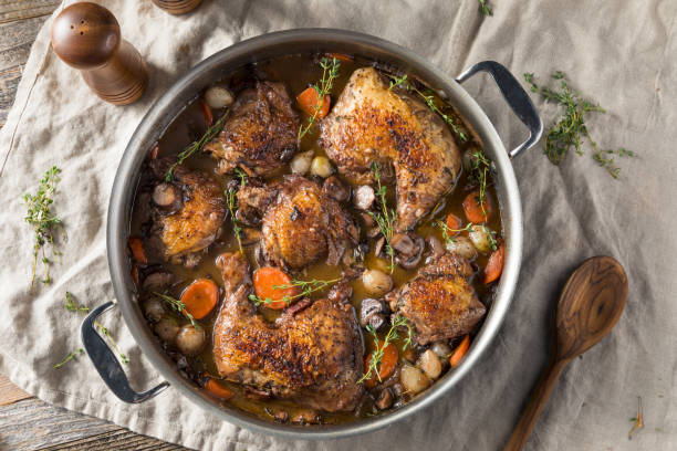 Homemade French Coq Au Vin Chicken Homemade French Coq Au Vin Chicken with Veggies and Sauce braised stock pictures, royalty-free photos & images