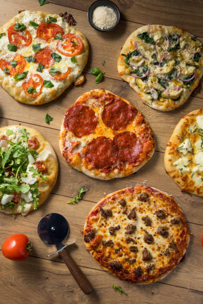istock Gourmet Homemade Assorted Wood Fired Pizzas 1085447760