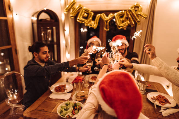 istock friends toasting at home for christmas 1085447886