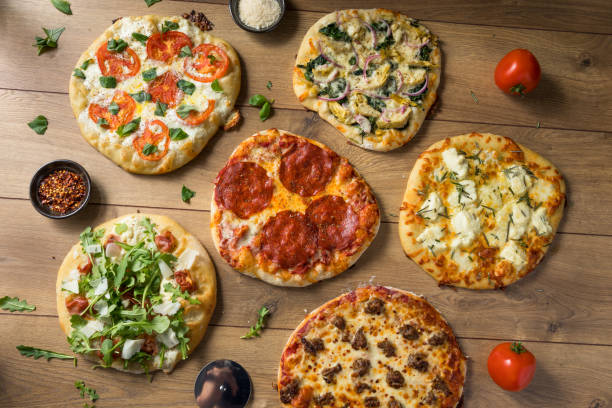 istock Gourmet Homemade Assorted Wood Fired Pizzas 1085448076