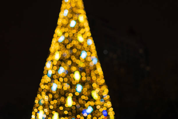 istock Abstract new year tree background, decorated with classical toys and illuminated with led lights 1085450122