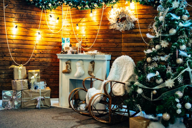 istock Romantic classical christmas interior with warm light, wooden elements and presents 1085450312