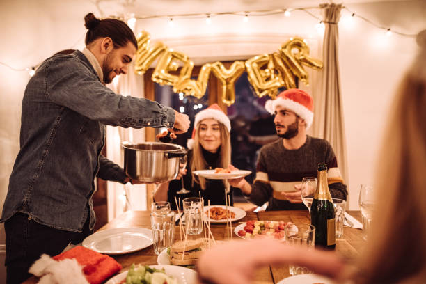 istock friends eating at the christmas dinner 1085451926
