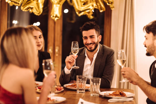 istock friends eating at the christmas dinner 1085451972