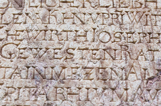 istock religious engraved letters on stone wall 1085456386