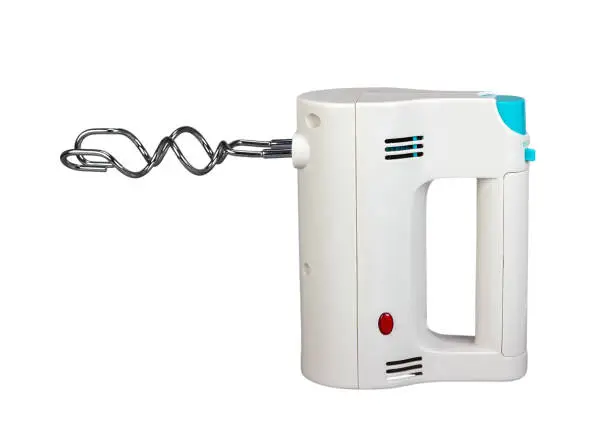 Electric hand mixer is a kitchen appliance intended for mixing isolated on white background