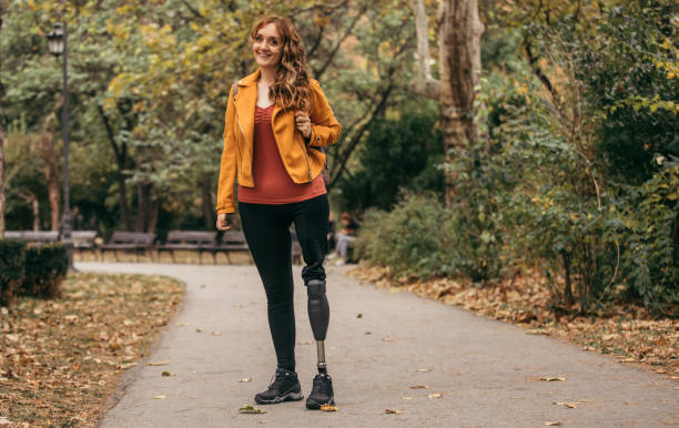 One woman in park, she has prosthetic leg.