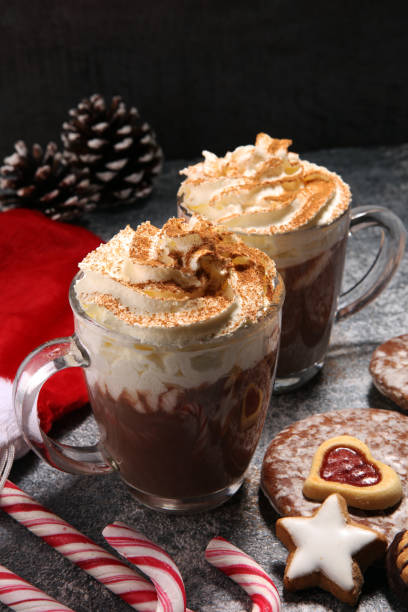 istock Hot chocolate cocoa with whipped cream for xmas on table 1085471954