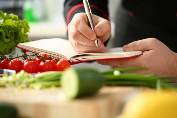 istock An open book of recipes on background 1085472032