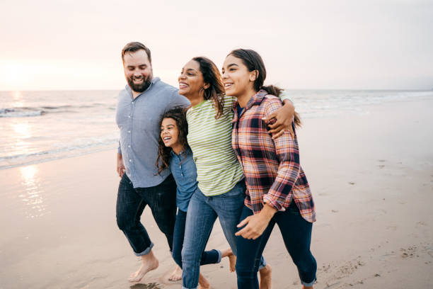 istock Sunset at the beach with family 1085472204
