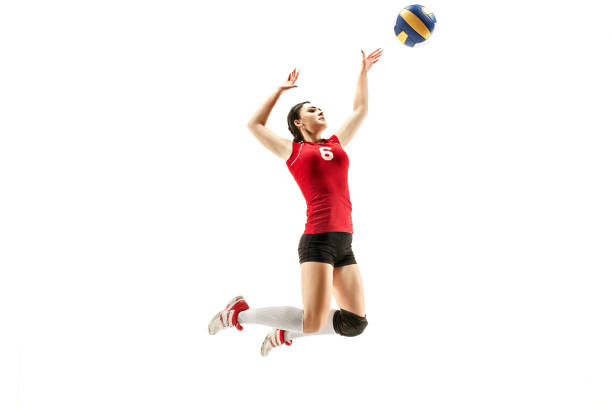 Female professional volleyball player isolated on white Female professional volleyball player isolated on white with ball. The athlete, exercise, action, sport, healthy lifestyle, training, fitness concept volleying stock pictures, royalty-free photos & images