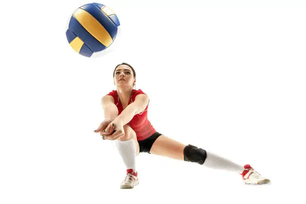 Female professional volleyball player isolated on white with ball. The athlete, exercise, action, sport, healthy lifestyle, training, fitness concept