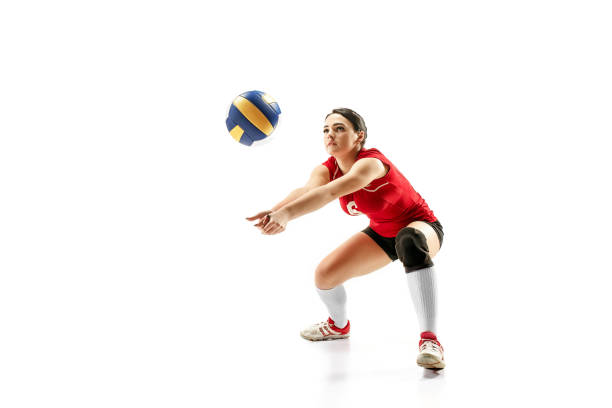 Female professional volleyball player isolated on white with ball. The athlete, exercise, action, sport, healthy lifestyle, training, fitness concept