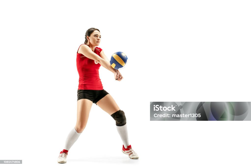 Female professional volleyball player isolated on white Female professional volleyball player isolated on white with ball. The athlete, exercise, action, sport, healthy lifestyle, training, fitness concept Volleyball - Sport Stock Photo