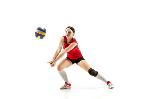 Female professional volleyball player isolated on white Female professional volleyball player isolated on white with ball. The athlete, exercise, action, sport, healthy lifestyle, training, fitness concept volleyball ball volleying isolated stock pictures, royalty-free photos & images