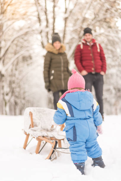istock Parents are having fun pulling their daughter who is on sleds 1085481364